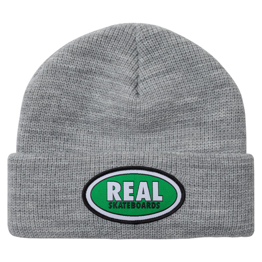 An REAL OVAL CUFF BEANIE HEATHER/GREEN with the word real on it.