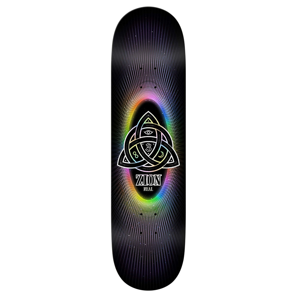 The REAL ZION POWER OF 3'S EASY RIDER by REAL is a black 8.5” skateboard deck featuring a triquetra with an eye, rainbow aura, and “Zion Power of 3” and “Real”—ideal for easy rider skateboard enthusiasts.