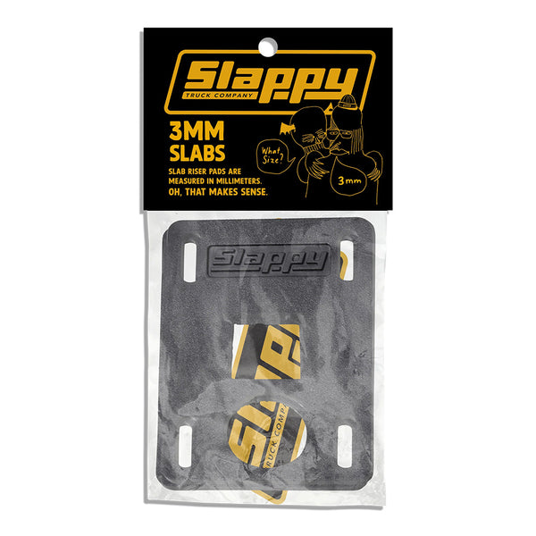 SLAPPY SLABS 3MM LOW RISERS by SLAPPY TRUCKS come in black with yellow branding, packaged in a clear plastic bag—ideal for a subtle lift and added shock absorption.