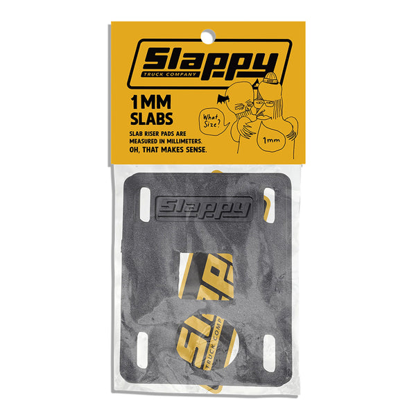 A pair of SLAPPY TRUCKS SLAPPY SLABS 1MM LOW RISERS, including two black pads and branded stickers, comes in a clear plastic bag with a yellow label.