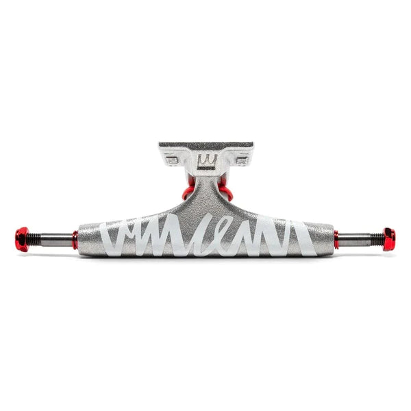 A silver and red skateboarding truck with a white signature across the front.