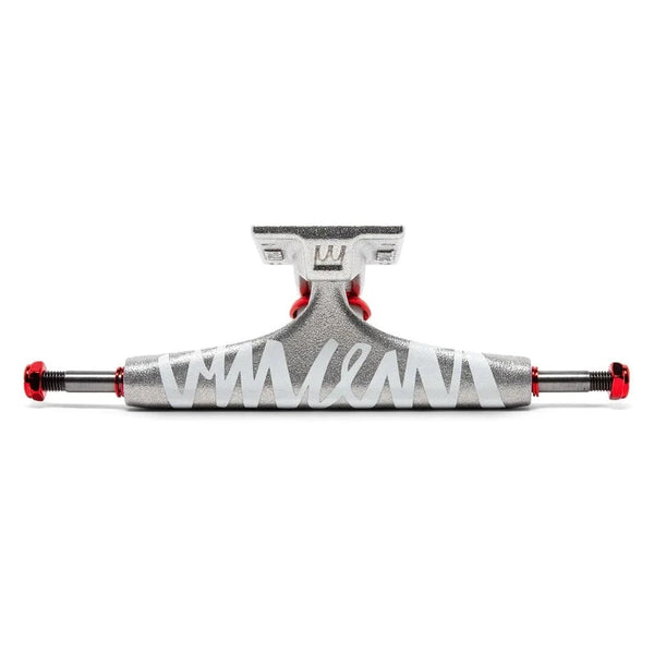 A silver and red skateboarding truck with a white signature across the front.