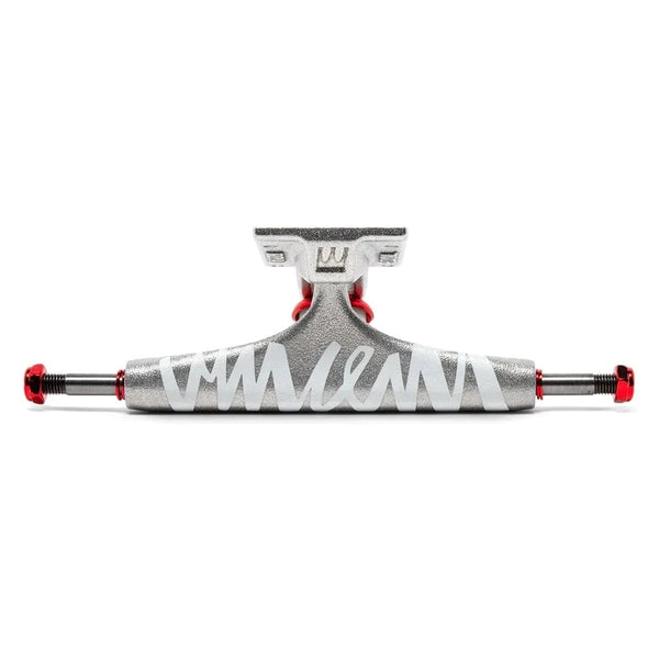A silver and red skateboarding truck with a white signature across the front.