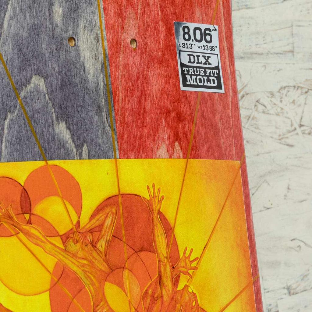 Close-up of the REAL HERMANN THOUSAND SUNS TRUE FIT skateboard deck showcasing a vibrant abstract design with figures and geometric shapes reminiscent of a HOLO CATHEDRAL. A label reads "8.06" - 31.3" x 13.88" DIX TRUE FIT MOLD.