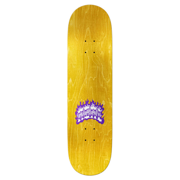 A REAL skateboard deck with a yellow wood finish, featuring a purple flame graphic with the text "HETT" in the center. This 8.25" wide REAL NICOLE PIG ROMP TRUE FIT deck ensures perfect control and stability, ideal for any skater seeking style and performance.