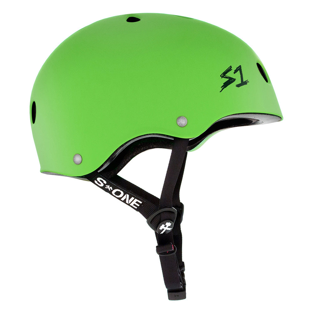 The S1 HELMET CO. S1 LIFER GREEN MATTE HELMET features dual certification, black adjustable straps, and multiple ventilation holes, displayed from a side view.