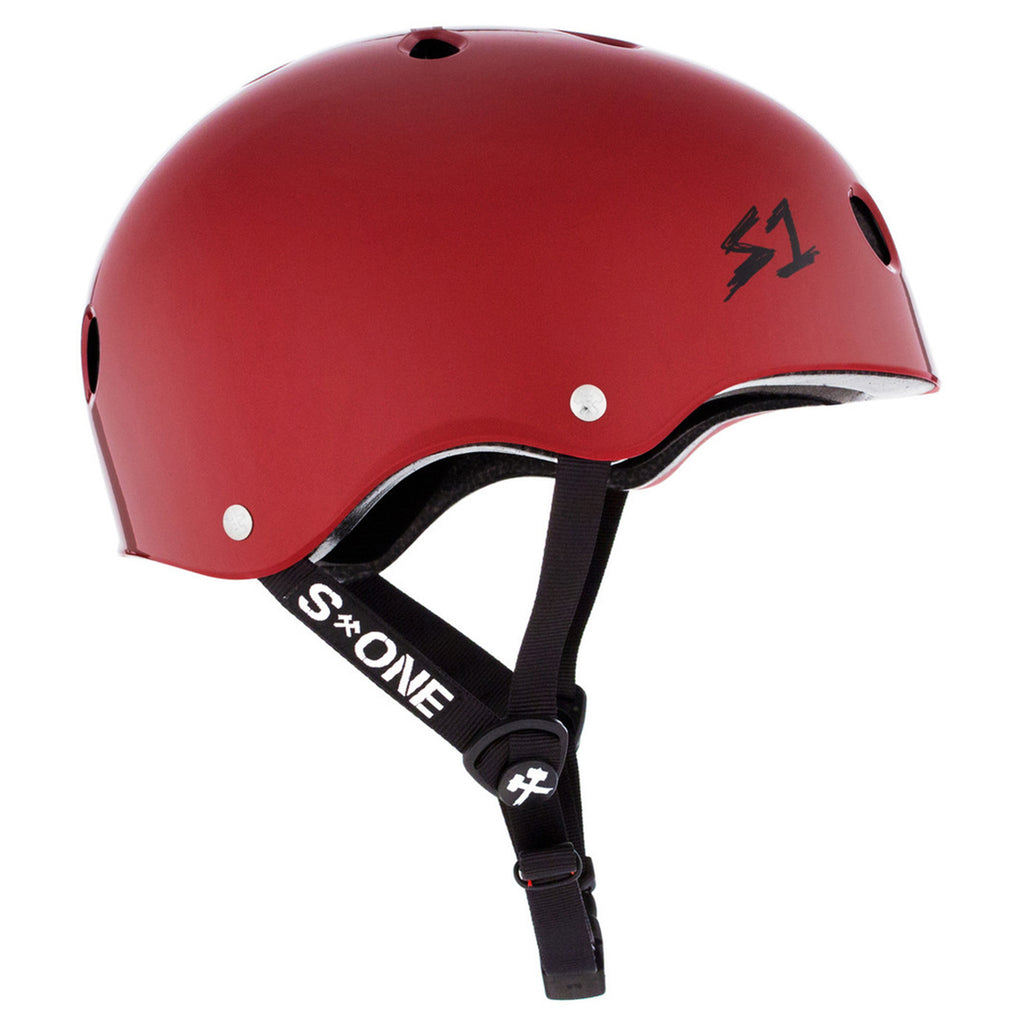 The side view of A dark red helmet with black straps and a black S1 logo.