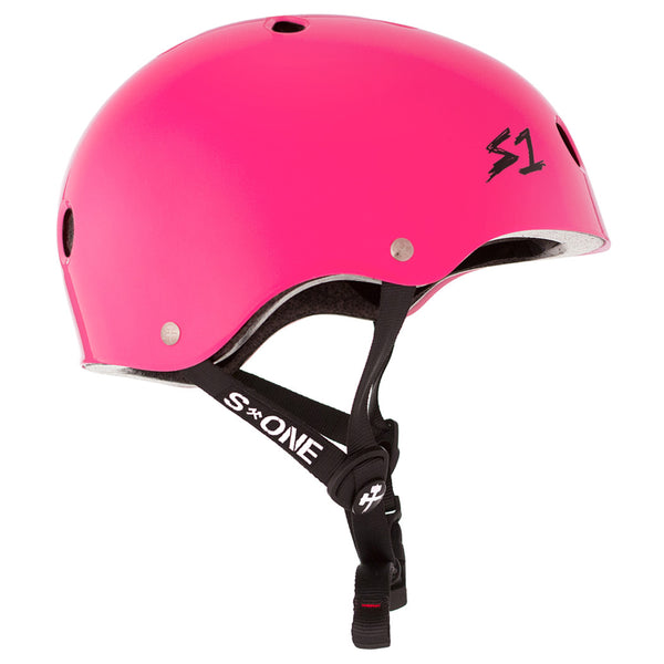 The side view of A bright pink shiny helmet with black straps and the black S1 logo on the front.