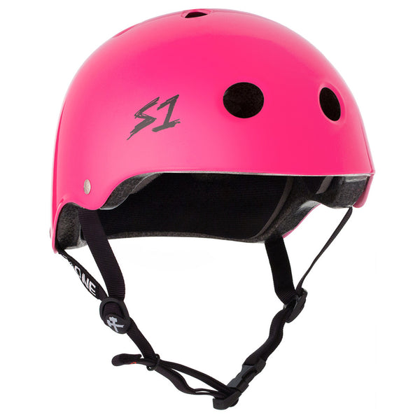 A bright pink shiny helmet with black straps and the black S1 logo on the front.