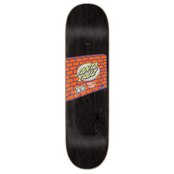 A black SANTA CRUZ skateboard with a brick wall on it.