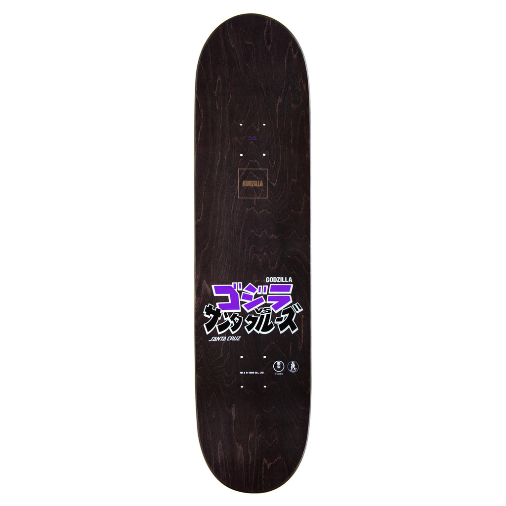 The SANTA CRUZ X GODZILLA SHIN KNOX FIREPIT skateboard deck by SANTA CRUZ showcases Japanese text with a vivid purple graphic set against a dark wood background, crafted from North American Maple.
