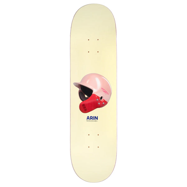 A skateboard with a SCI-FI FANTASY ARIN HELMET atop it.