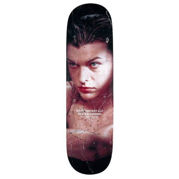 A skateboard with an image of Alice from Resident Evil and the Sci-Fi Fantasy logo in white.