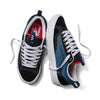 A pair of VANS SKATE OLD SKOOL 36+ NAVY/RED sneakers with white laces, one shoe upright and the other on its side, highlights their iconic style on a plain backdrop. These sneakers boast durable Vans DURACAP construction for enhanced longevity.