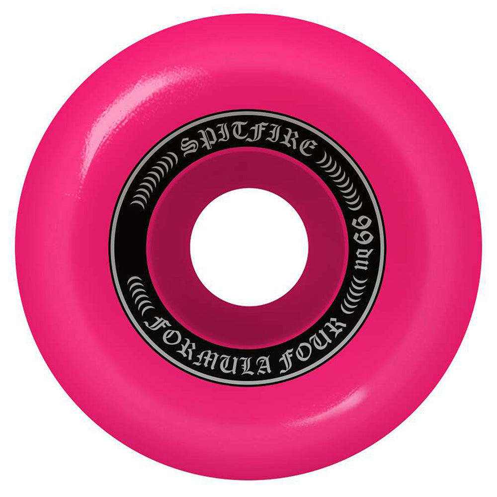 The SPITFIRE O.G. CLASSICS 99A 53MM PINK skateboard wheel features a bright pink design with a black and white "Formula Four" logo, "m86" label, and the classic look around the center hole.