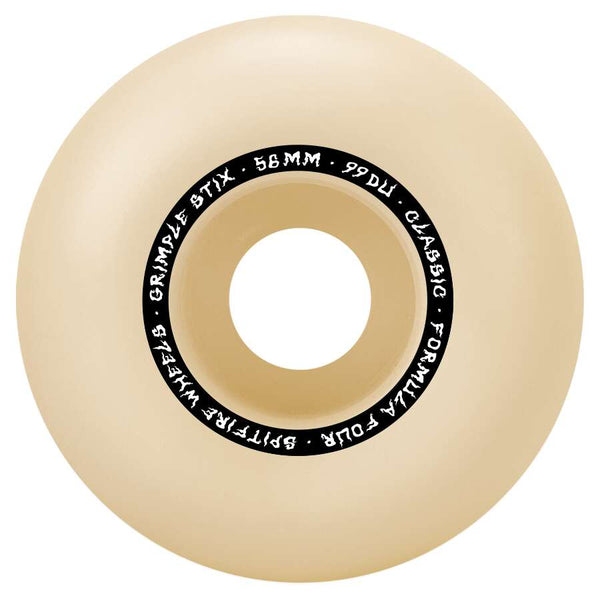 A beige SPITFIRE wheel for skateboarding with "SPITFIRE X GRIMPLE STIX F4 CLASSICS 99D 56MM" printed around the center.