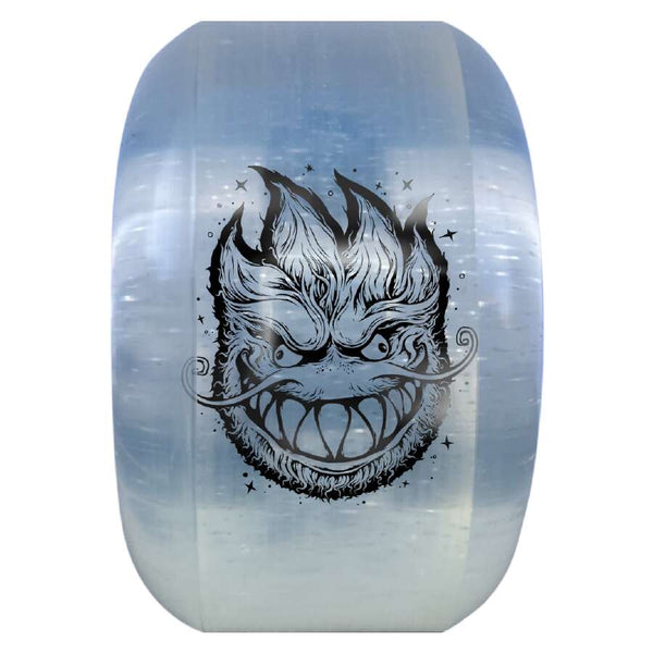 A translucent SPITFIRE X GRIMPLE STIX SAPPHIRE RADIAL 90D 56MM wheel with a black illustration of a menacing face featuring sharp teeth, flames, and a curled mustache; perfect for skateboarding enthusiasts. Inspired by the SPITFIRE X GRIMPLE STIX collaboration, this wheel captures attention on the streets.