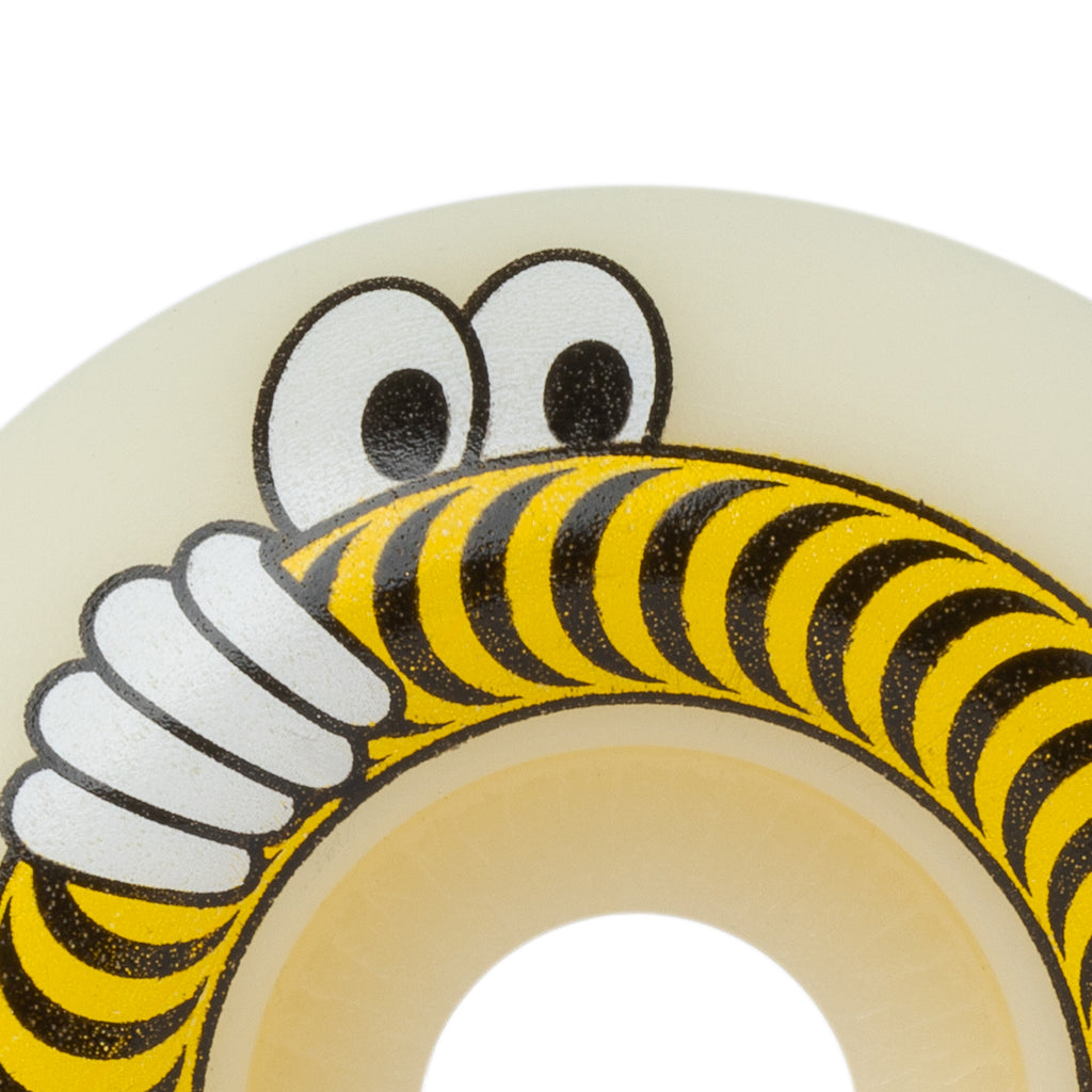 A white SPITFIRE X LAST RESORT AB F4 CLASSIC 99D 52MM skateboard wheel with a cartoon face on it from SPITFIRE.