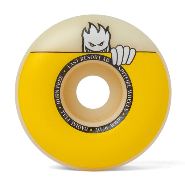 A yellow and white SPITFIRE X LAST RESORT AB F4 RADIAL FULL 99D 56MM skateboard wheel with a cartoon character on it.