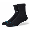 The STANCE SOCKS ICON QUARTER in black features a subtle white logo on the sides, accented by a blue-turquoise stripe at the toes. These crew socks provide ultimate comfort with STANCE's targeted cushioning.