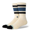 Presenting a stylish pair of STANCE SOCKS BOYD ST DARK ROYAL in a cream color, these socks feature blue and black horizontal stripes, along with black heels and toes. Crafted from a comfortable cotton blend by the renowned brand STANCE, they offer the perfect crew height for any casual outfit.