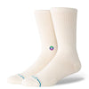 A pair of white large STANCE SOCKS COTTON CREW ENCIRCLE displaying a small multicolored logo on the sides and ice blue accents on the toes.