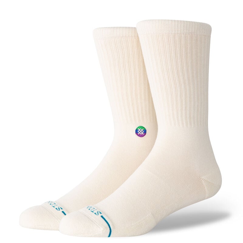 A pair of white large STANCE SOCKS COTTON CREW ENCIRCLE displaying a small multicolored logo on the sides and ice blue accents on the toes.