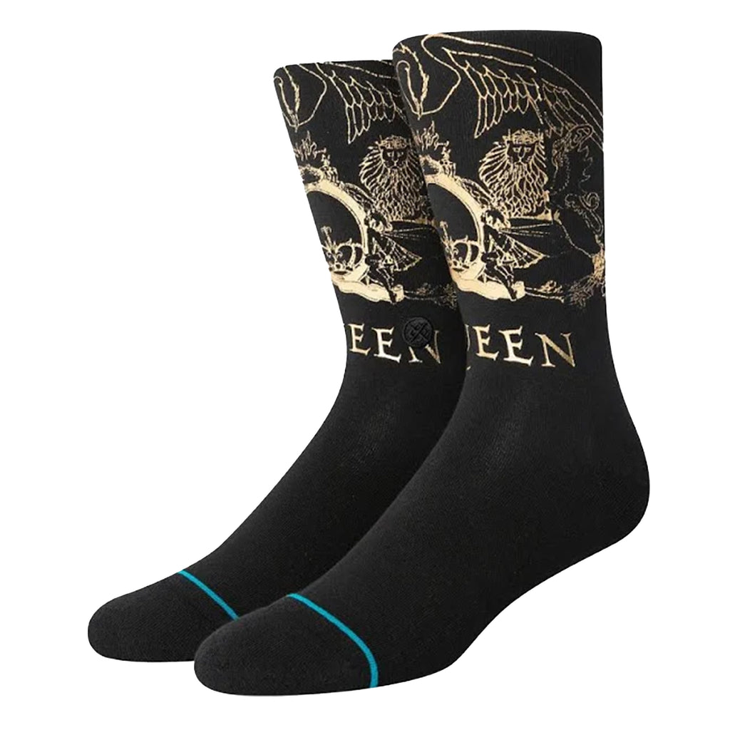 A pair of black socks with a gold queen album cover.