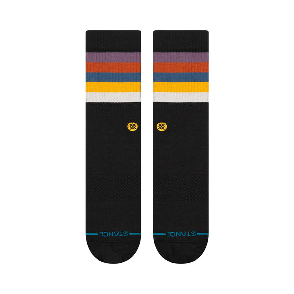 The STANCE SOCKS MALIBOO GRAPE LARGE are crafted from a cozy cotton blend and feature multicolored stripes at the top in shades of yellow, pink, dusty rose, red, and white. The brand logo "STANCE" is prominently displayed near the toes.