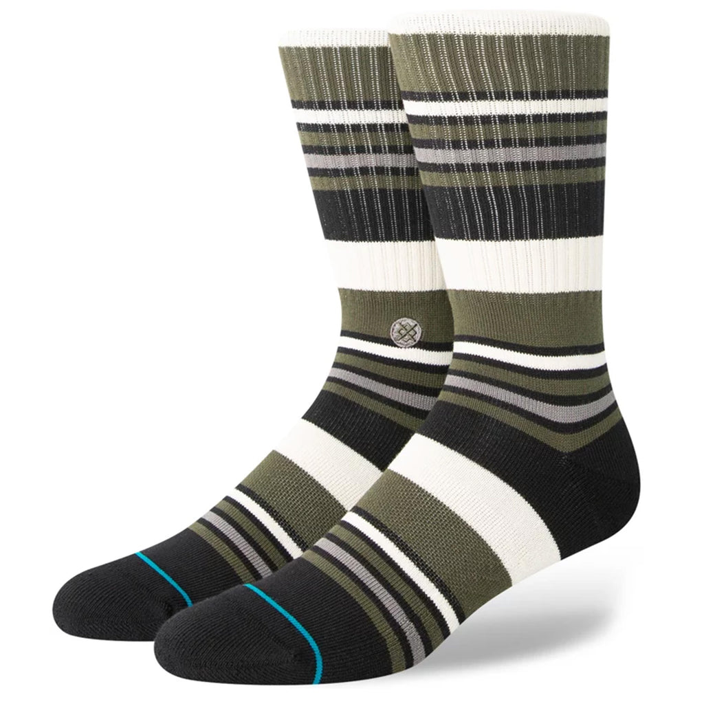 A pair of olive, black, white, and grey stripped socks.