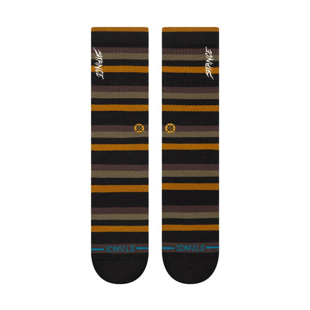 Pair of STANCE SLIPPING CREW SOCKS in large, featuring alternating brown, yellow, and black bands. Made from a cotton blend with medium cushioning for added comfort. The brand name "Stance" is printed at both the top and bottom.