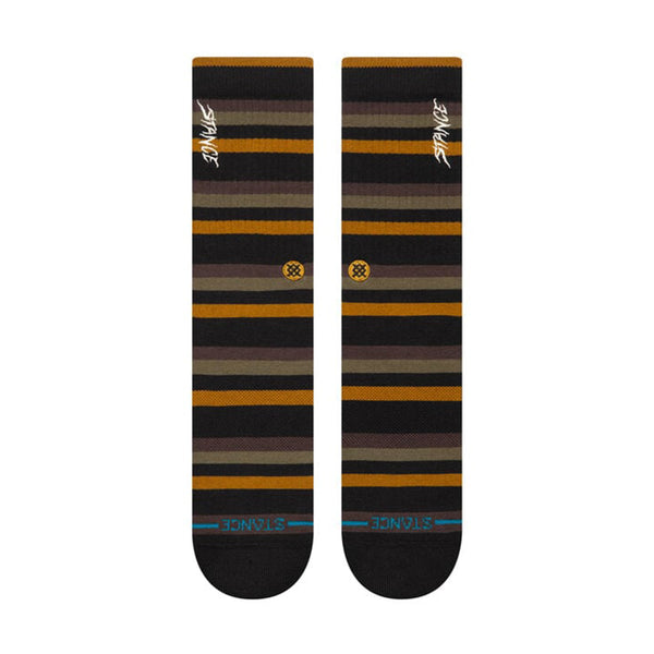 Pair of STANCE SLIPPING CREW SOCKS in large, featuring alternating brown, yellow, and black bands. Made from a cotton blend with medium cushioning for added comfort. The brand name "Stance" is printed at both the top and bottom.