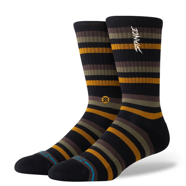 The STANCE SOCKS SLIPPING CREW BLACK LARGE showcase bold stripes in black, dark green, and orange. Made from a soft cotton blend, they provide medium cushioning for maximum comfort. The top features the iconic "Stance" branding.