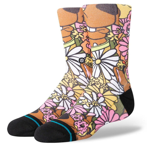 A pair of hippie floral print socks with flowers and scooby doo.