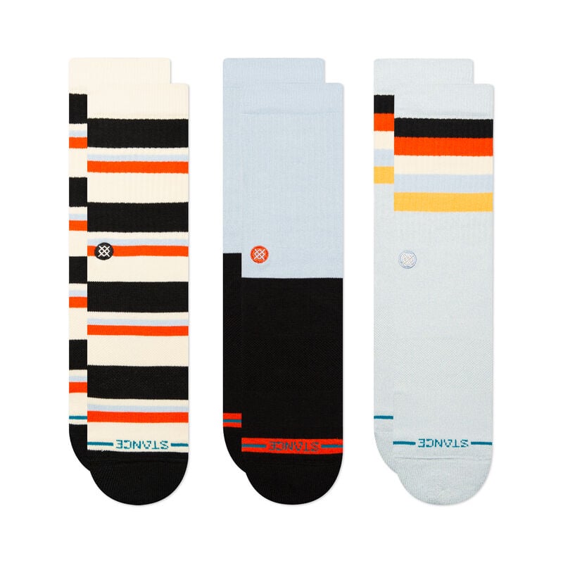 Three pairs of colorful **STANCE STANCE SOCKS WEEKLY GRIND 3 PACK ICE BLUE LARGE** with geometric patterns. The socks display various stripes and blocks in colors such as black, white, orange, yellow, and light blue. Each pair features seamless toe closure for ultimate comfort.