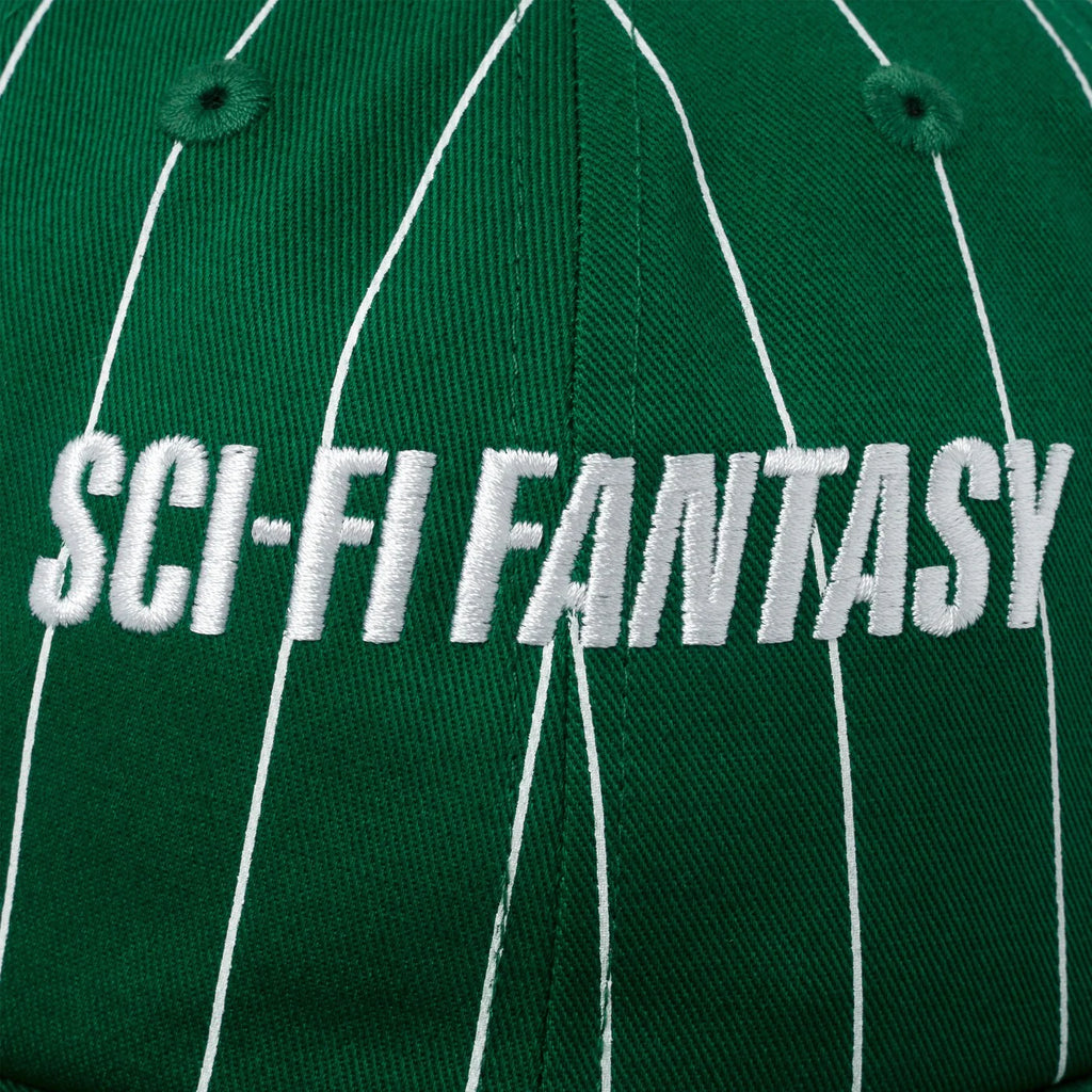 A close up of the white embroidered sci-fi logo scross the front.