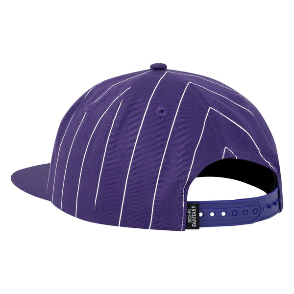 The back purple, plastic snap-back clasp of the hat.