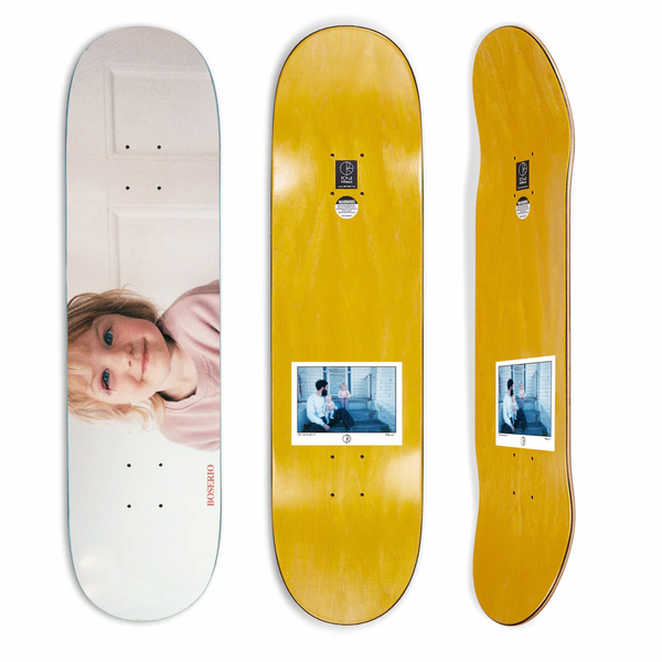 A couple of POLAR BOSERIO RUN CLEO skateboards sitting next to each other.