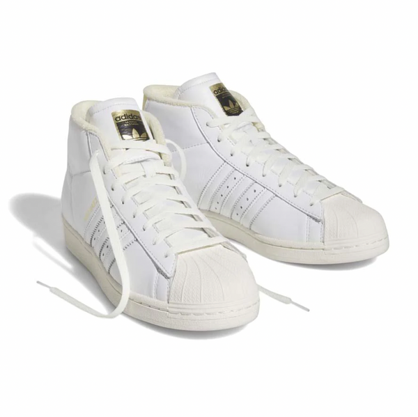 A pair of white ADIDAS SAM NARVAEZ PRO MODEL ADV WHITE / EASY YELLOW sneakers on a white background.