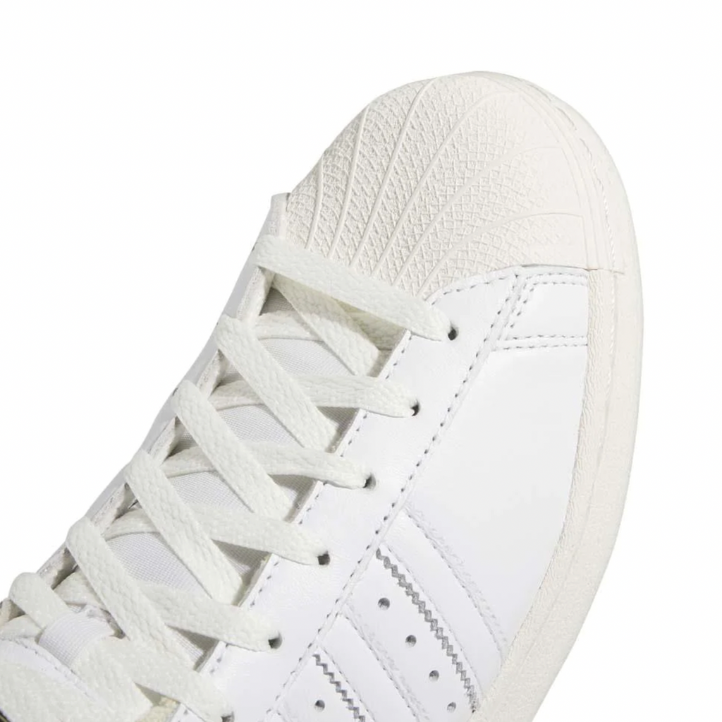 A pair of ADIDAS Sam Narvaez Pro Model ADV White/Easy Yellow sneakers on a white background.
