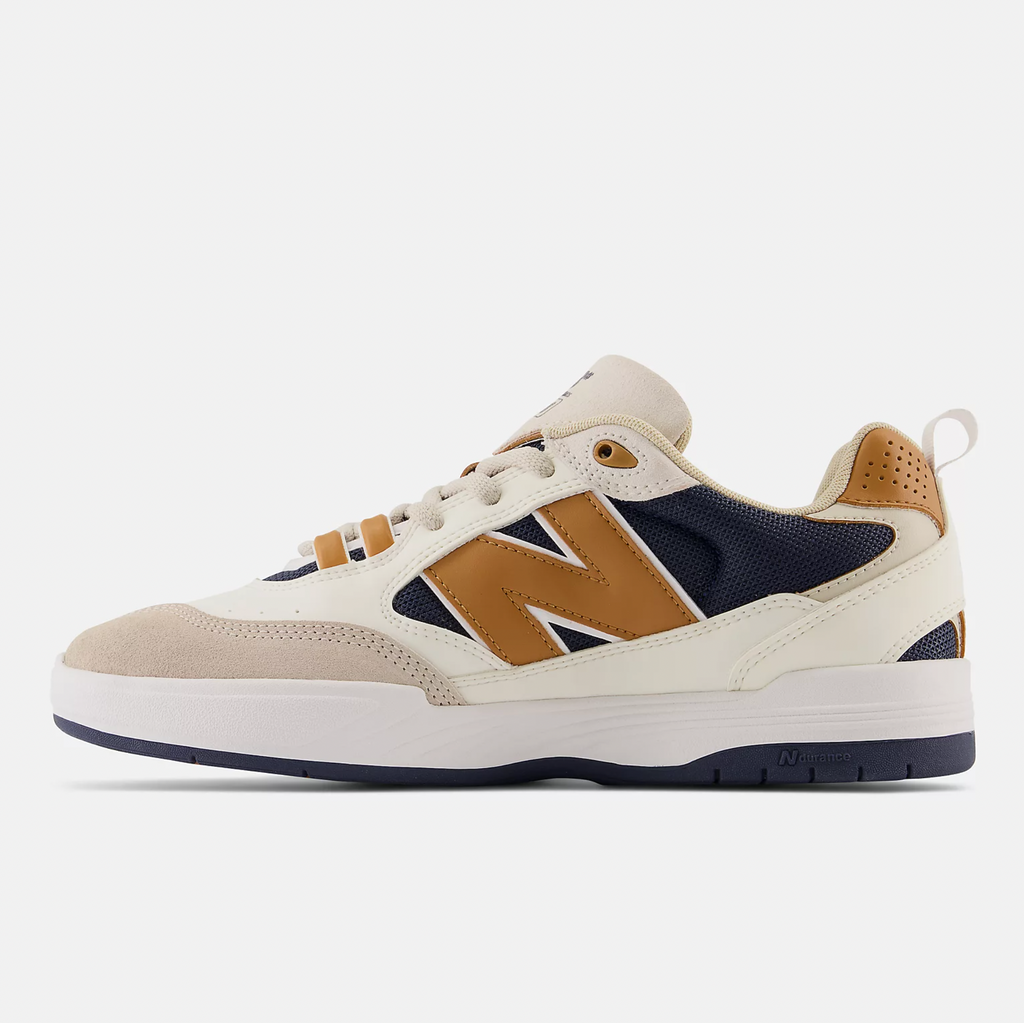 A white and brown NB Numeric 808 Tiago sneaker with a beige and blue accent and a white sole.