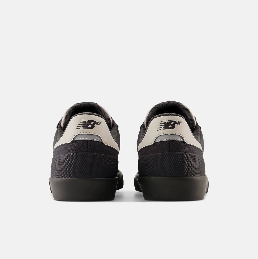 A pair of NB NUMERIC 272 Black/Sea Salt shoes on a white background.