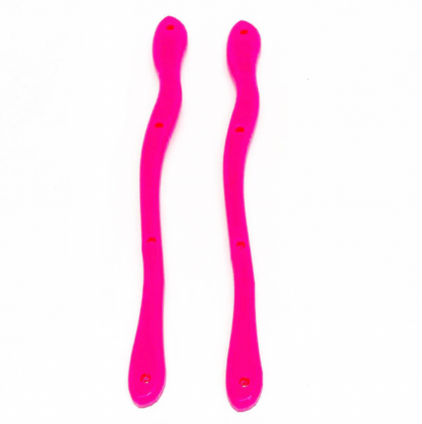 A pair of abstract shaped pink skateboard rails with 4 holes.