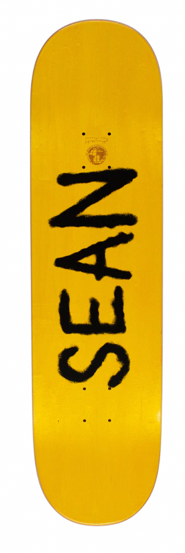 "Sean" signature text on top of stained skateboard top