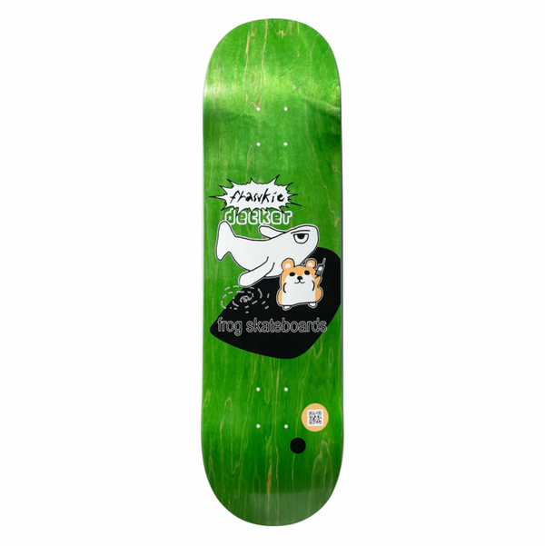 A green stained skateboard with a drawing of a whale and a hamster.