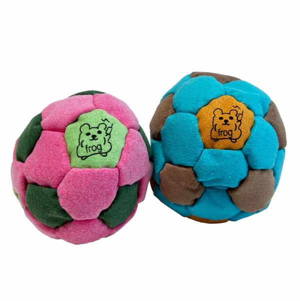 Two hacky sacks on a white background.
