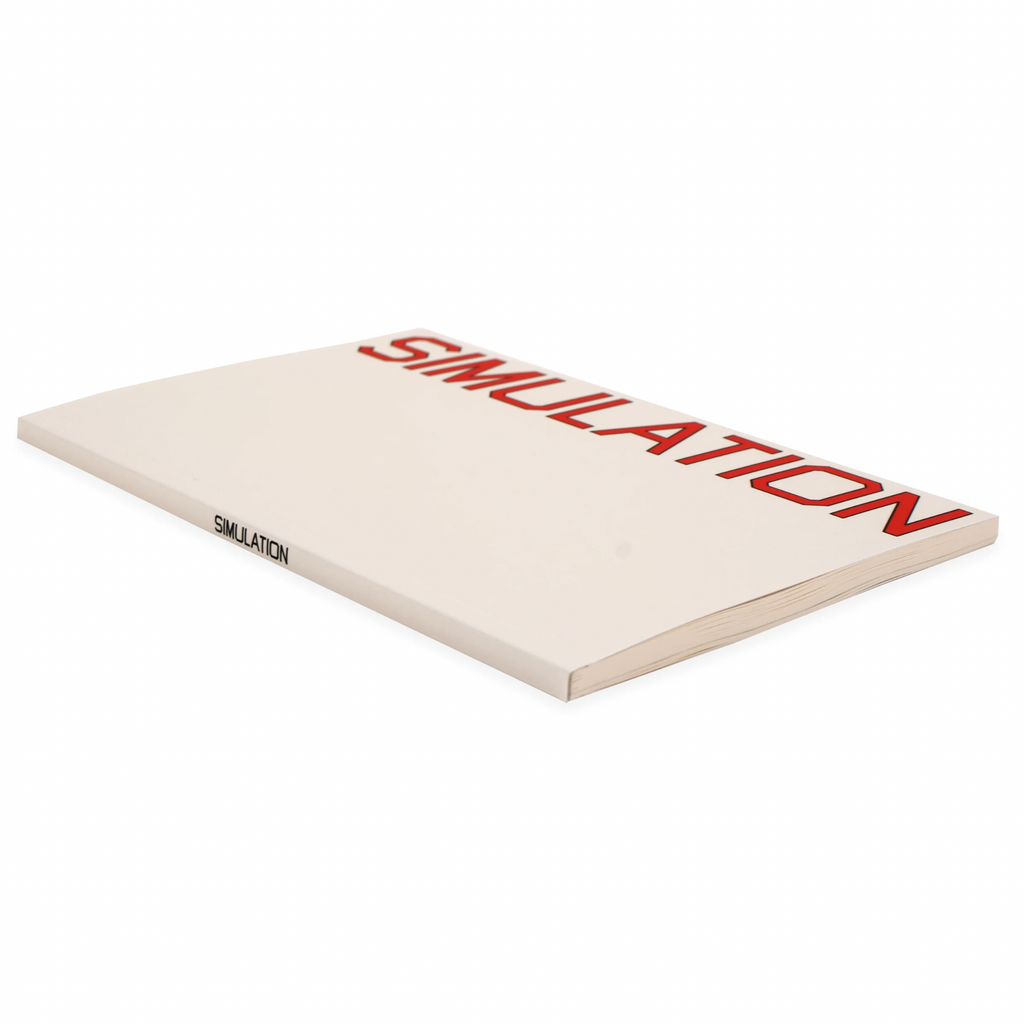 A white QUASI book with the word simulation on it, serving as a companion for simulation enthusiasts.
