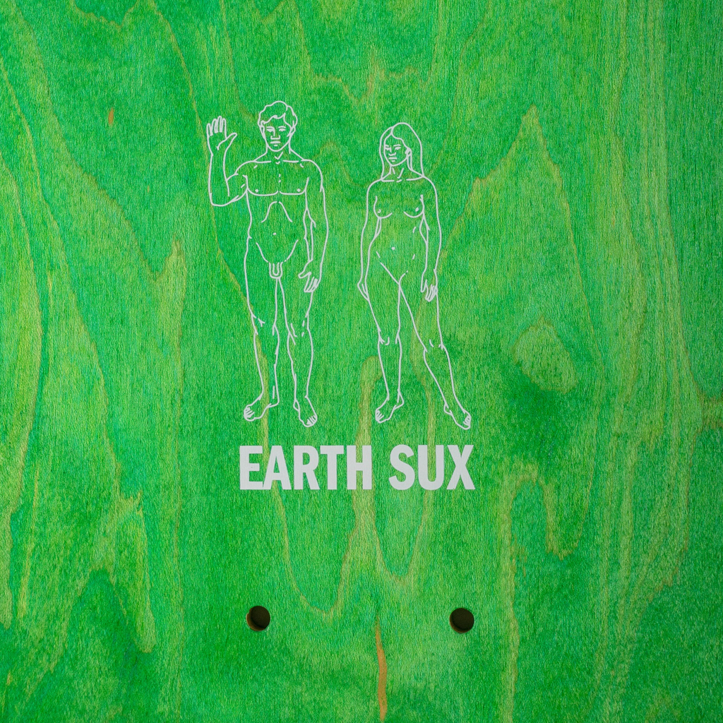 A close up of a green stained top skateboard deck with a drawinf of two naked humans that reads "Earth Sux".