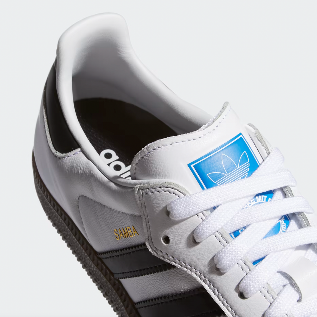 A pair of white and blue ADIDAS SAMBA ADV WHITE / BLACK sneakers.