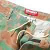 A pair of BUTTER GOODS SANTOSUOSSO CAMO PANT shorts with a zipper.
